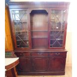 A reproduction astral glazed cupboard bookcase