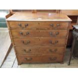 A Georgian style chest of five drawers with cross banded inlay on splayed feet