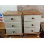 A pair of cream and grey painted bedside chest of three drawers