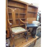 An oak elbow chair, a vintage travelling trunk, a demi-lune side table,