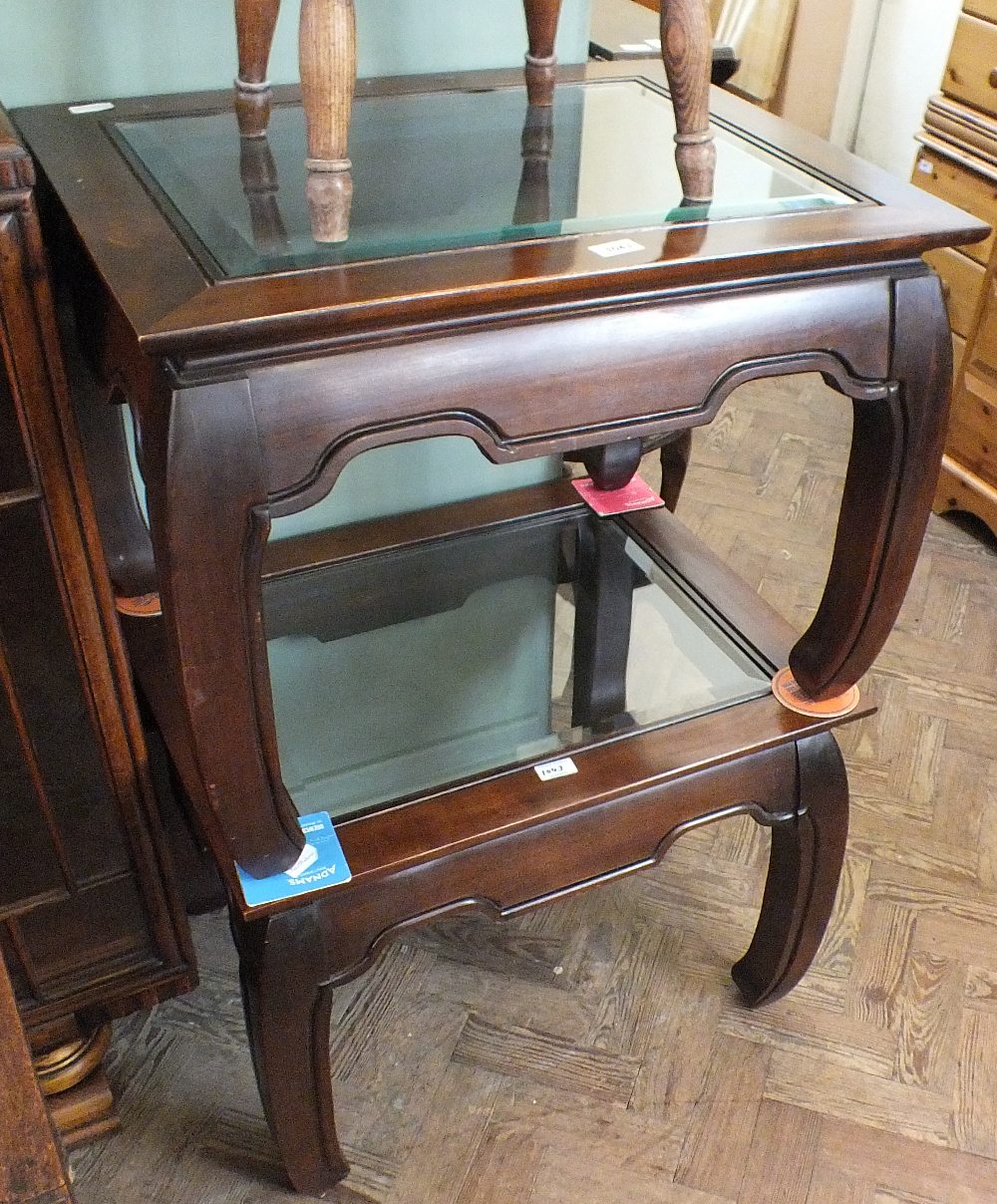 A pair of Oriental style hardwood side tables with glass top