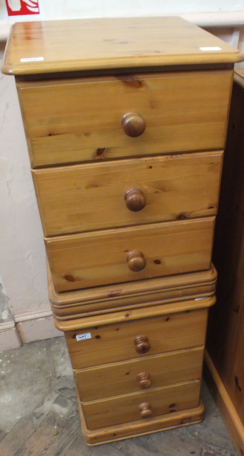 A pair of modern bedside chest of three drawers