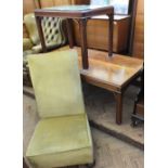 A gold upholstered low chair,