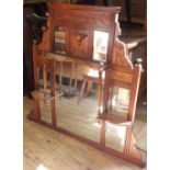 An Edwardian overmantel mirror with shelving