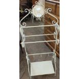 A modern cream painted metal bathroom stand