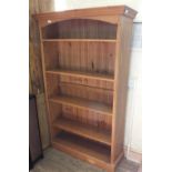 A modern pine bookcase with adjustable shelves