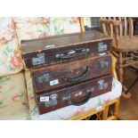 Three small vintage suitcases