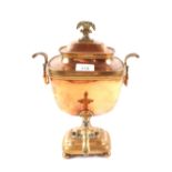 A Regency copper samovar with rams head ring handles,