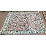 A machine made Persian style pink ground tree and bird rug,