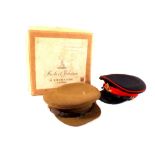 Two military caps, one with Royal Artillery badge in original box,