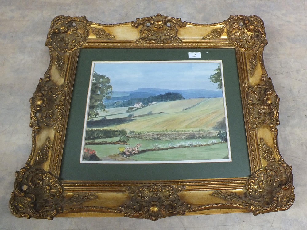 A watercolour of a hilly landscape signed Short in ornate gilt frame,