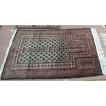 An Afghan red ground rug,