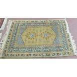 A Persian style brown ground floral rug,