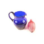 A Nailsea red and white swirled glass flask plus a blue glass jug