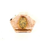 An Art Deco variegated marble clock with French movement