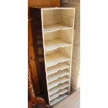 A vintage painted office shelving unit