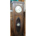 A 1920's eight day oak long case clock