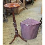 A reproduction mahogany plant stand and loom laundry basket