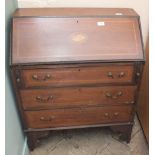 A small Edwardian bureau with shell pattern inlay