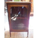 A Edwardian music cabinet with mirrored tile interior