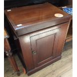 An Edwardian mahogany lift top cupboard washstand with fitted ceramic sink and single door and