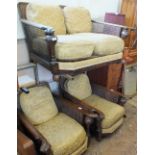 A Bergere oak framed two seat sofa and chairs with carved arms