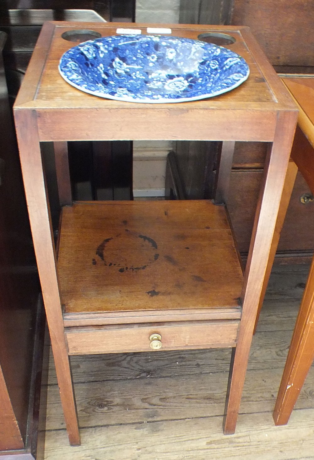 A 19th Century oak washstand with blue and white china bowl and single door