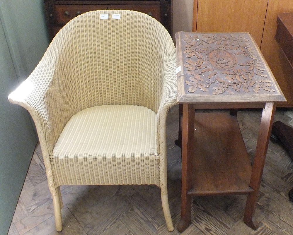 A cream upholstered loom chair and carved hardwood occasional table with under tier