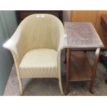 A cream upholstered loom chair and carved hardwood occasional table with under tier