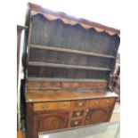 A 19th Century country made oak open back dresser