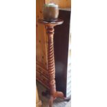 A turned hardwood torchere and a wooden biscuit barrel