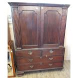 An early 19th Century mahogany frame linen press with two short and two long drawers,