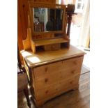 An Edwardian pine dressing chest of three drawers and mirrored top with single drawer