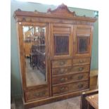 An Edwardian compactum wardrobe by Maple & Co.