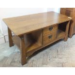 A modern oak coffee table with two drawers and under shelf