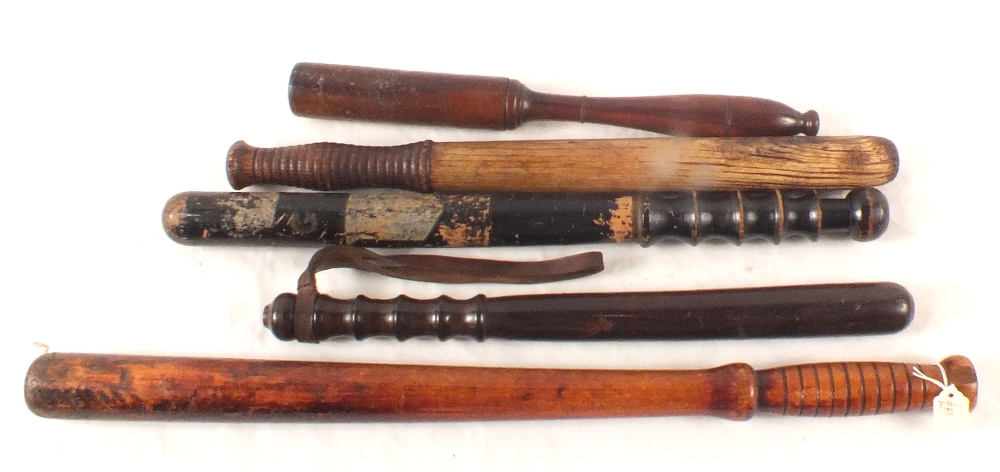 Five various Police truncheons including one for horse mounted use and a G.R.