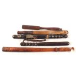 Five various Police truncheons including one for horse mounted use and a G.R.