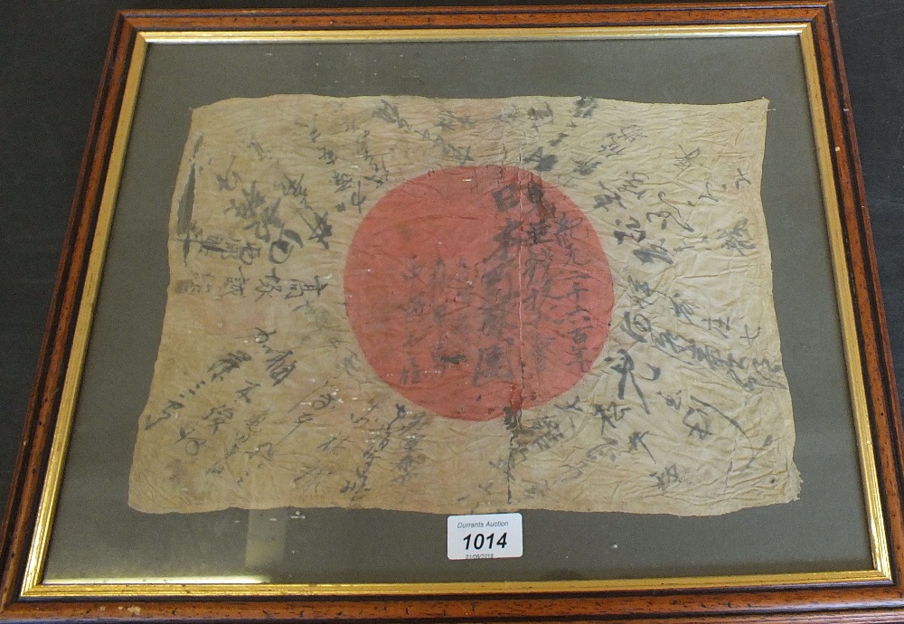 A Japanese (PATTERN) flag bearing script reputed to have been brought back from the Far East in