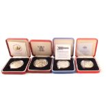 Four cased silver proof coins including 40th Coronation Anniversary crown,