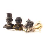 Three reproduction cast iron money boxes plus a bibendum