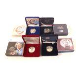 Four cased silver proof coins including Diana memorial coin, Victorian Anniversary crown,