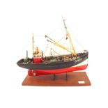 A wooden hulled model trawler