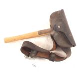 A firemans axe with leather sheath and belt