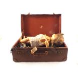 A case containing a doll and dolls furniture