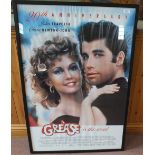 A framed film poster Grease,