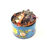 A tin of plastic and a few die cast figures