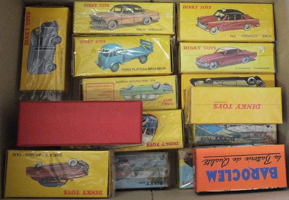 A box of fifteen Atlas Dinky cars