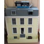 A large Georgian style dolls house plus a quantity of furniture