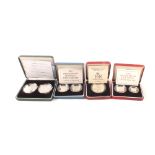 Four cased silver proof coin sets including Coronation 40th Anniversary crown,