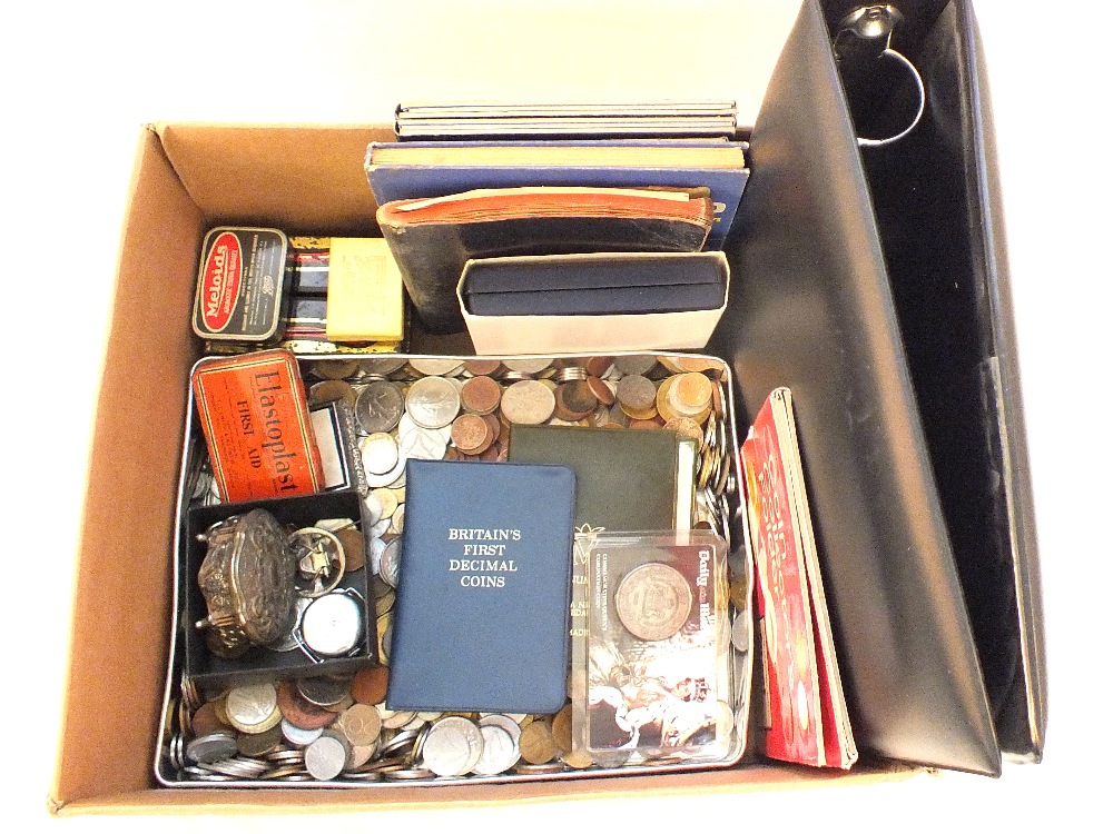 A box of mixed world coinage plus a few stamps etc